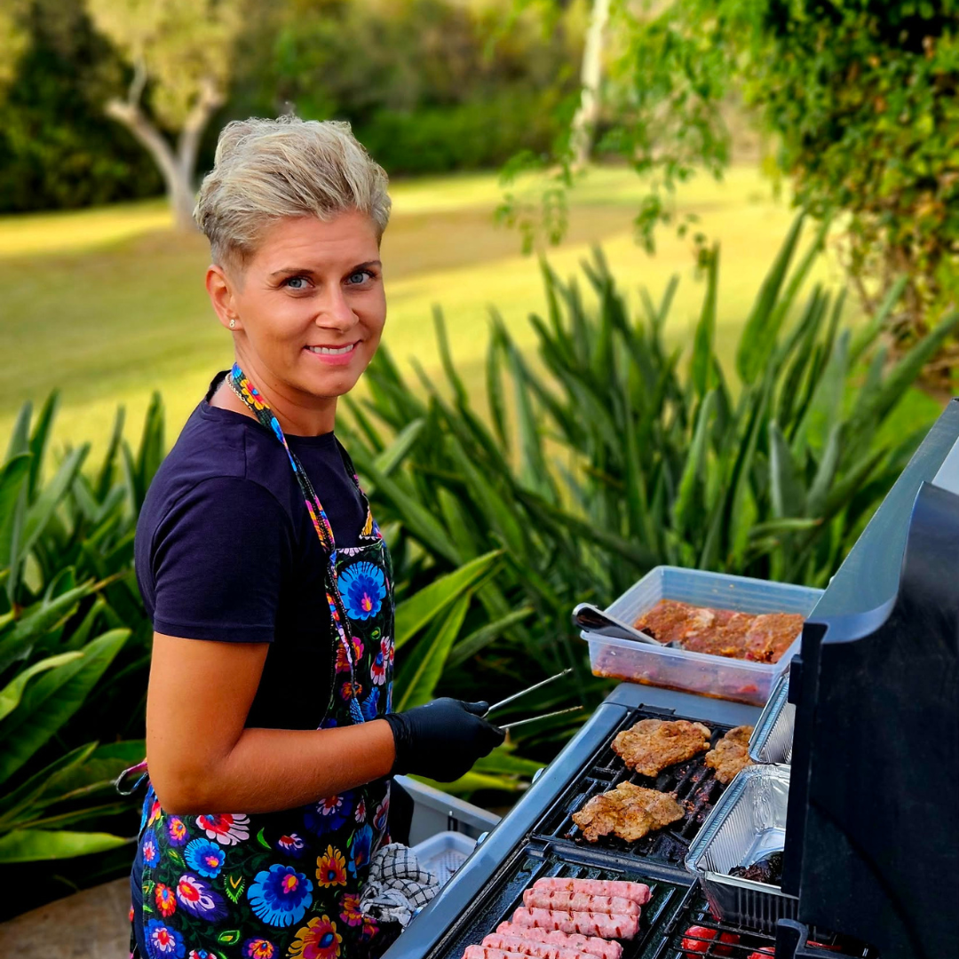 Wedding caterer preparing food on an outdoor grill