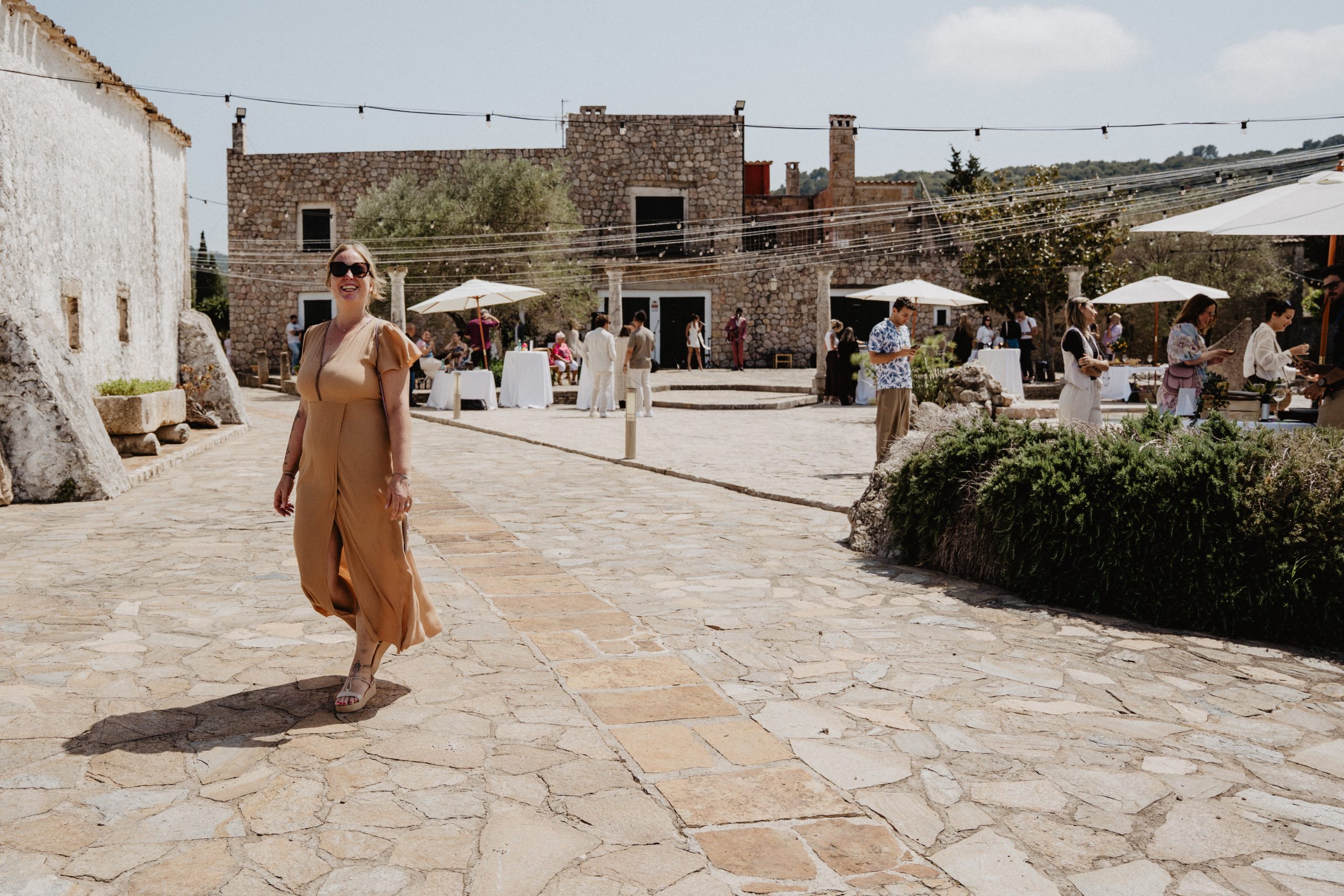 Mallorca finca stone courtyard during a Dybiec Wedding — guests gathering in natural light