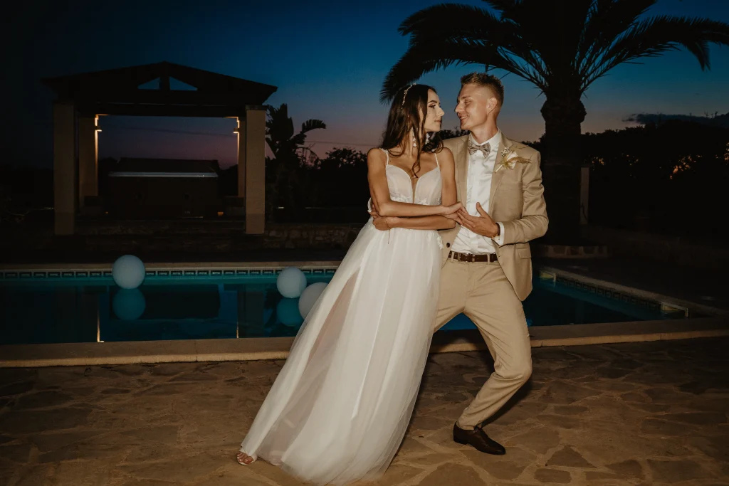 Couple enjoying an effortless Mallorca wedding guest experience in the evening