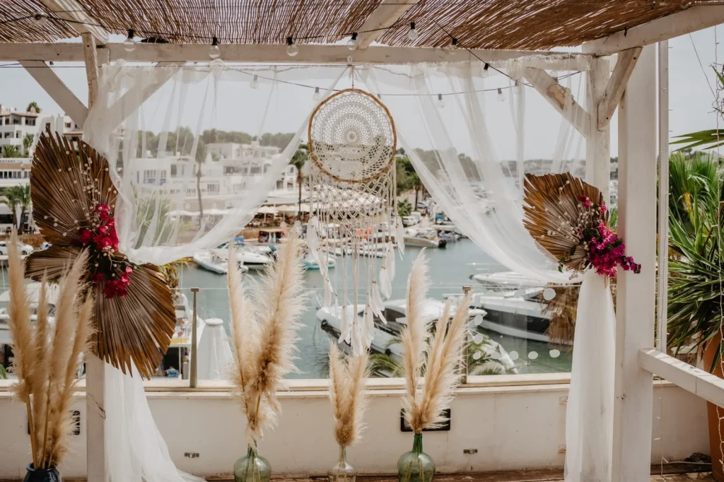Light ceremony fabrics at an exposed waterfront wedding venue in Mallorca