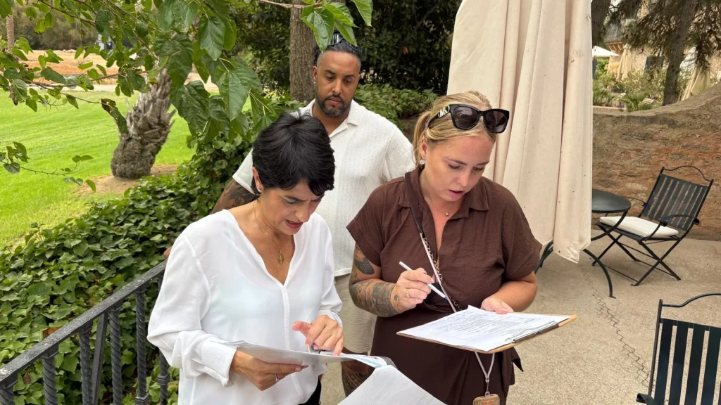 Wedding planning team reviewing documents and schedules at a Mallorca venue